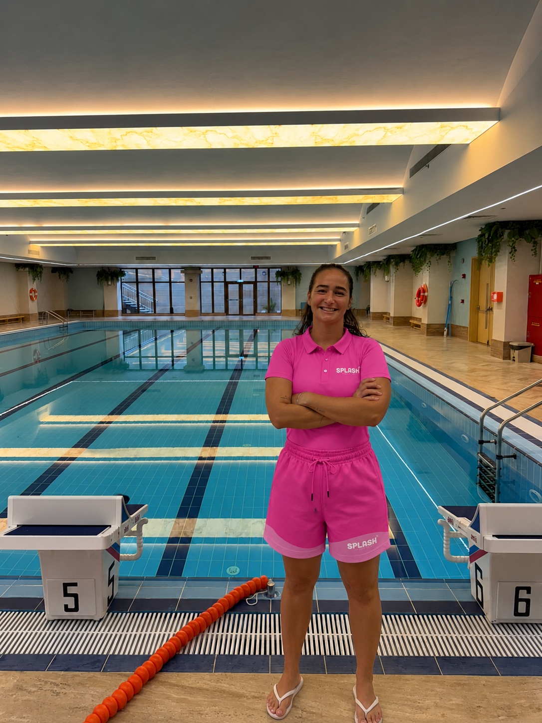 Coach Bianca of Splash Swimming Club by the pool at Newton School